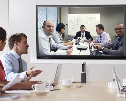 Group Of Businesspeople Meeting Around Boardroom Table